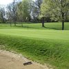 A view of the 10th green guarded by bunkers on both sides at  Middletown Country Club