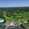 Aerial view of the clubhouse and parking area at Highland Country Club